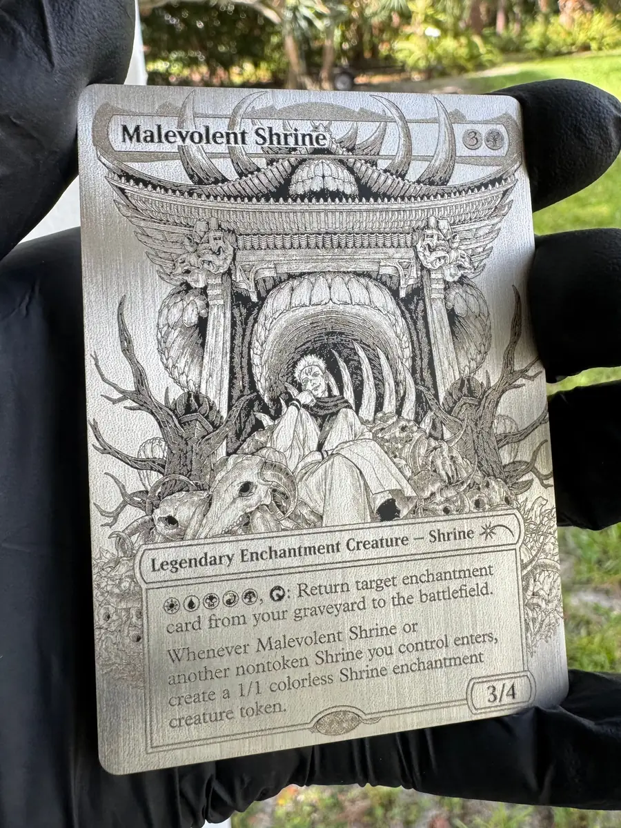 Malevolent Shrine, engraved into a stainless steel plate and held in the hand