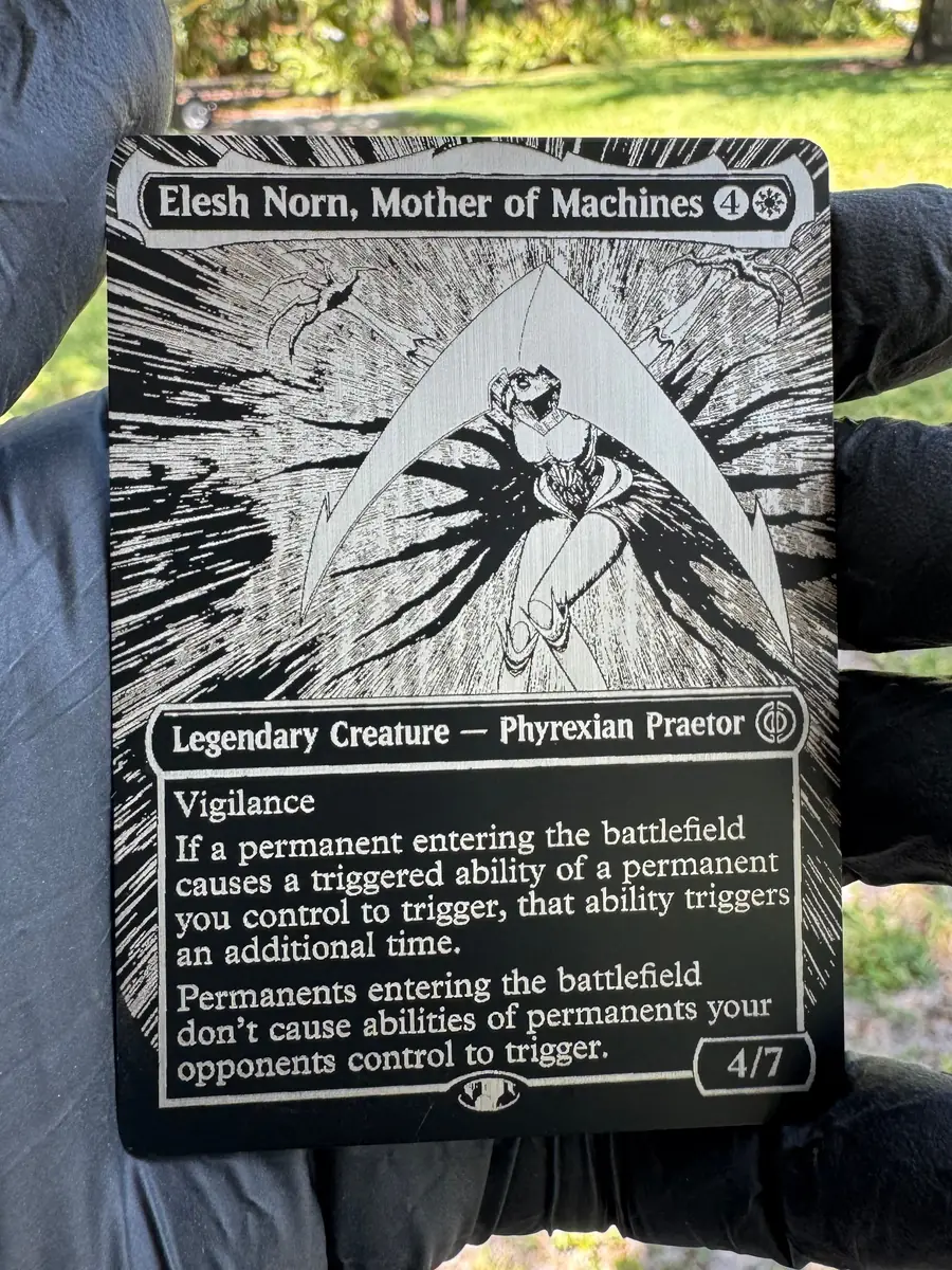 Elesh Norn, Mother of Machines, engraved into a stainless steel plate and held in the hand